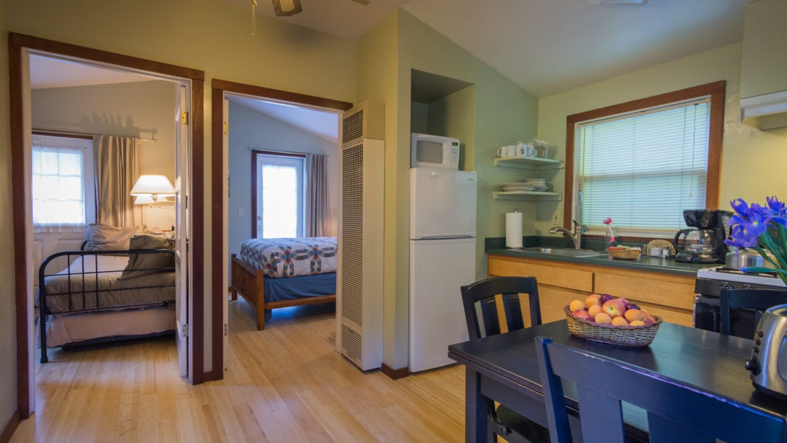 The Robin Cabin sitting with view to two bedrooms at Creekside Resort