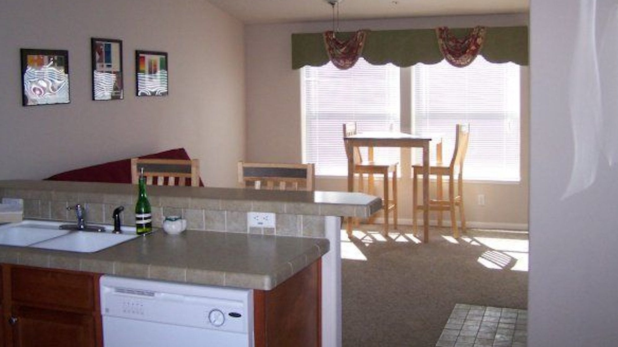 Falcon suite kitchen and living room at Creekside Inn and Resort